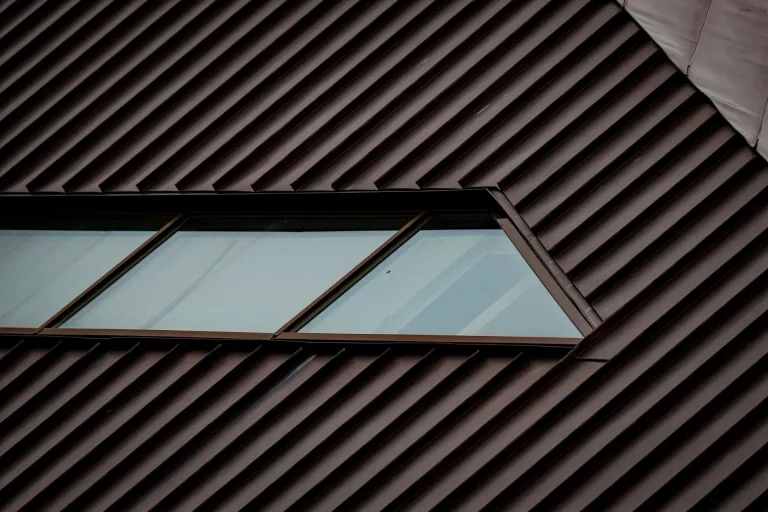 Brown textured metal roof with skylight windows