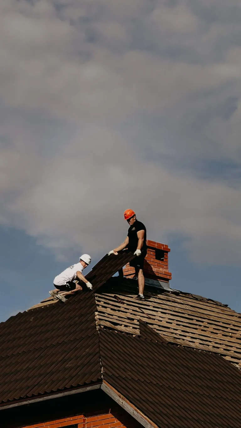 Roofing crew repairing a damaged roof in Colorado Springs